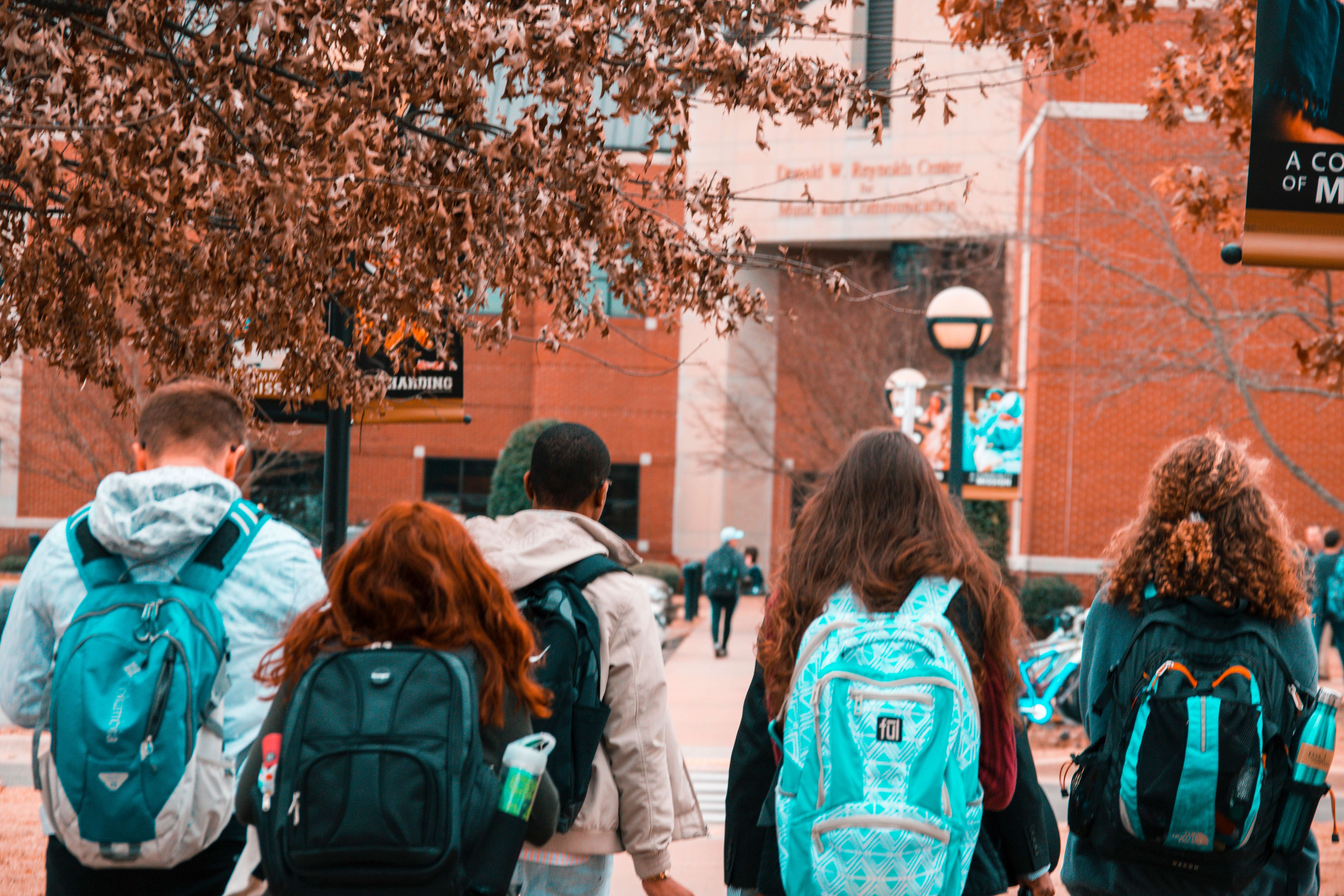 people wearing backpacks 1454360