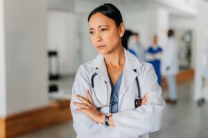 Female Asian doctor looking off to the side