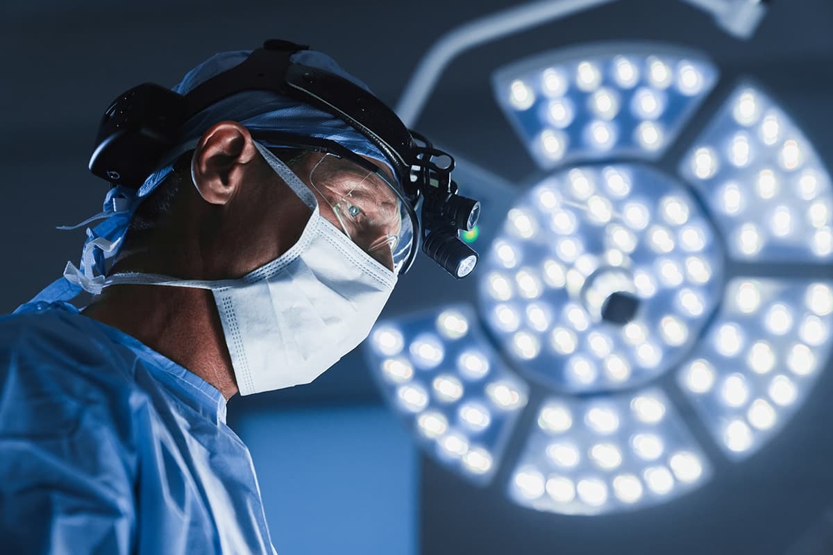 Male physician working in operating room