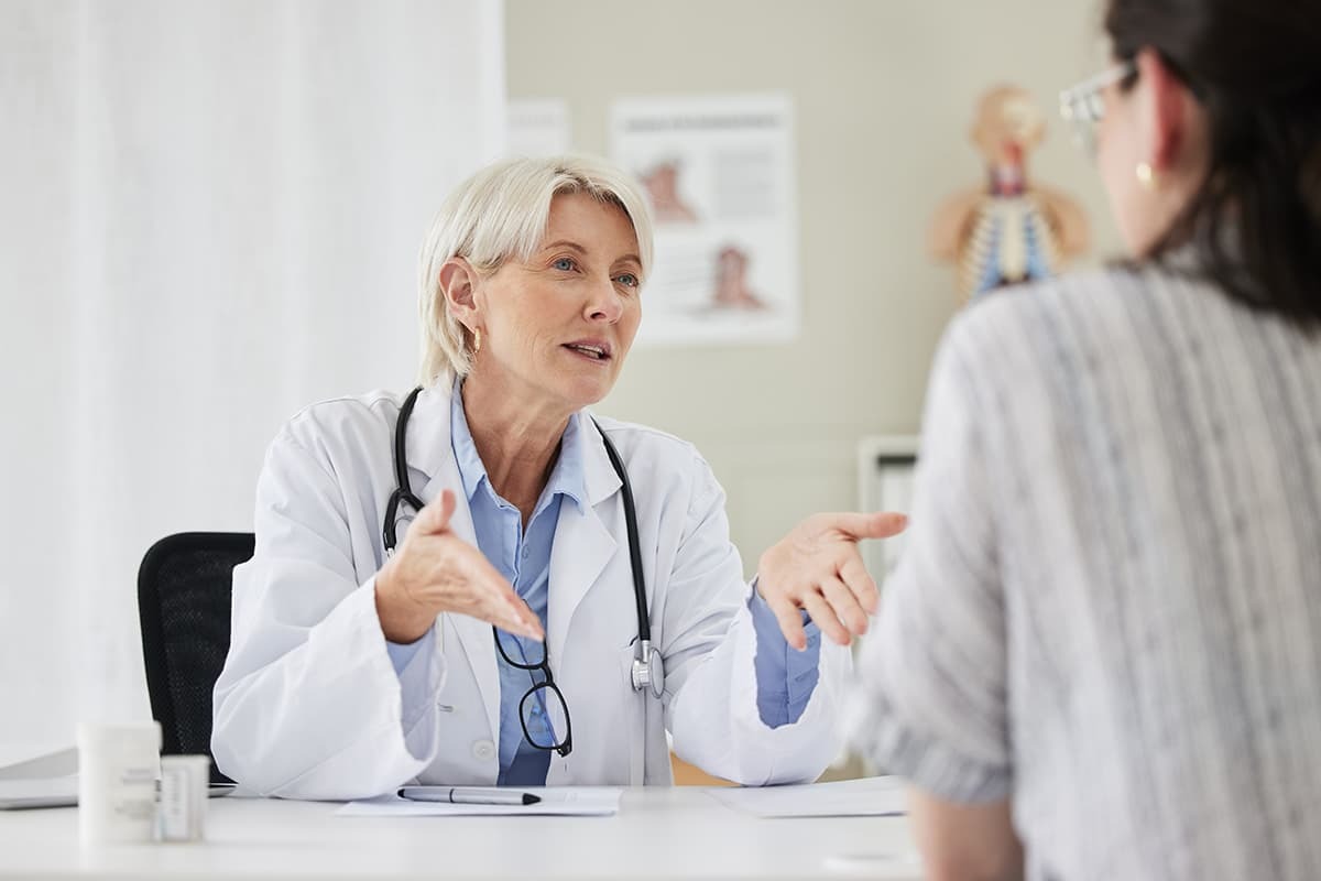 Medical provider talking to a patient