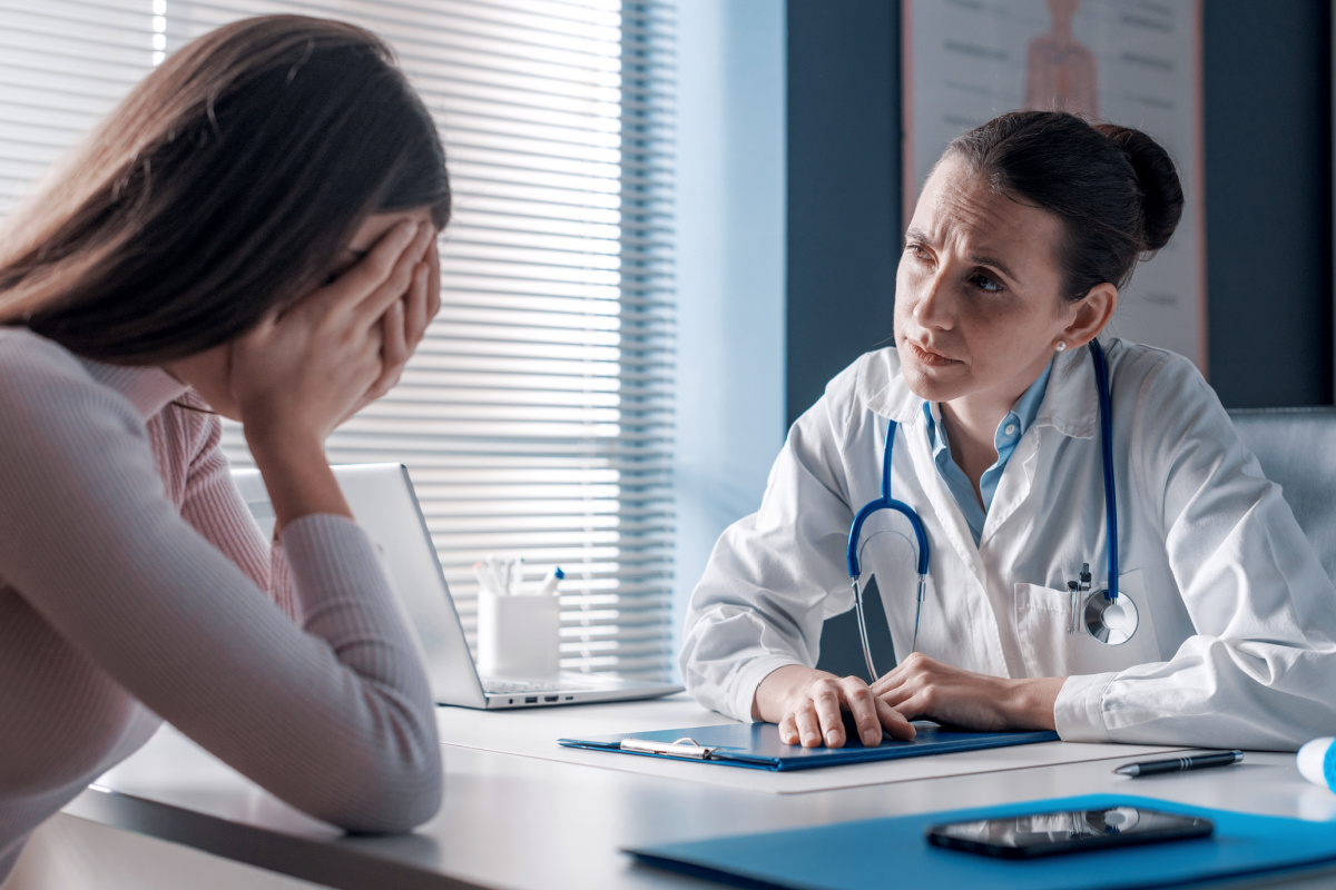 Female physician with a crying patient