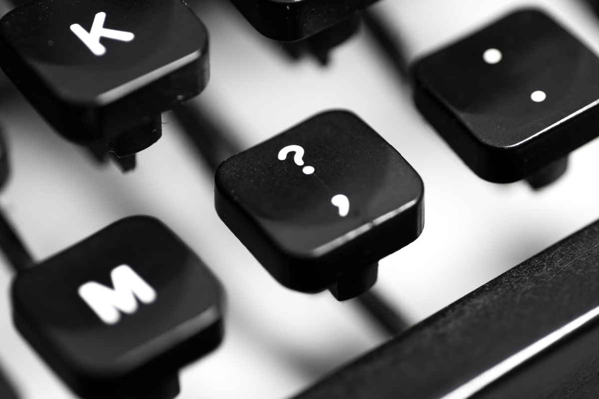 Close up of comma key on black and white keyboard