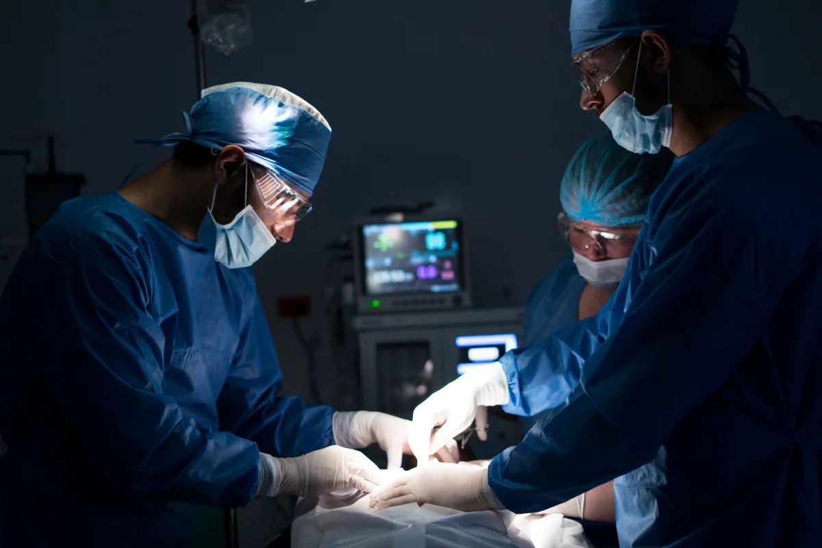 Surgeons performing emergency surgery