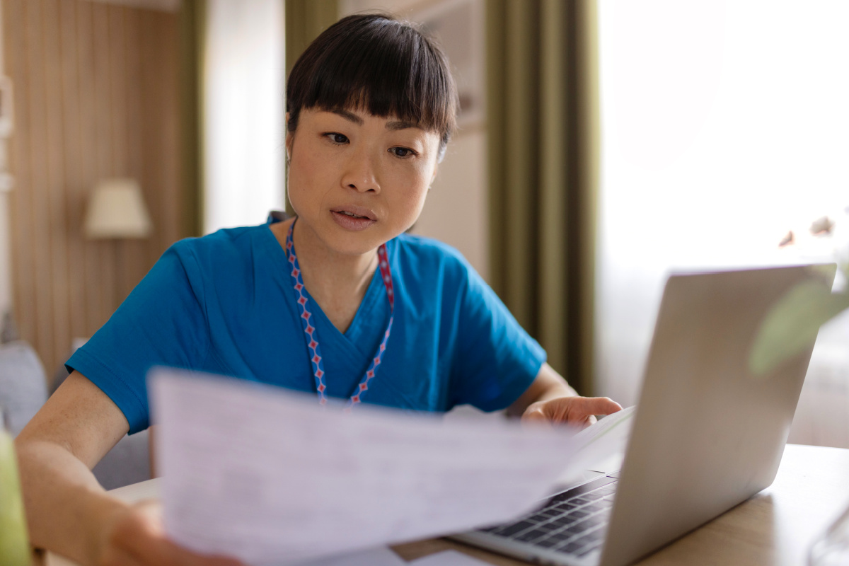 Female physician reading a legal demand letter written by ChatGPT's latest AI model