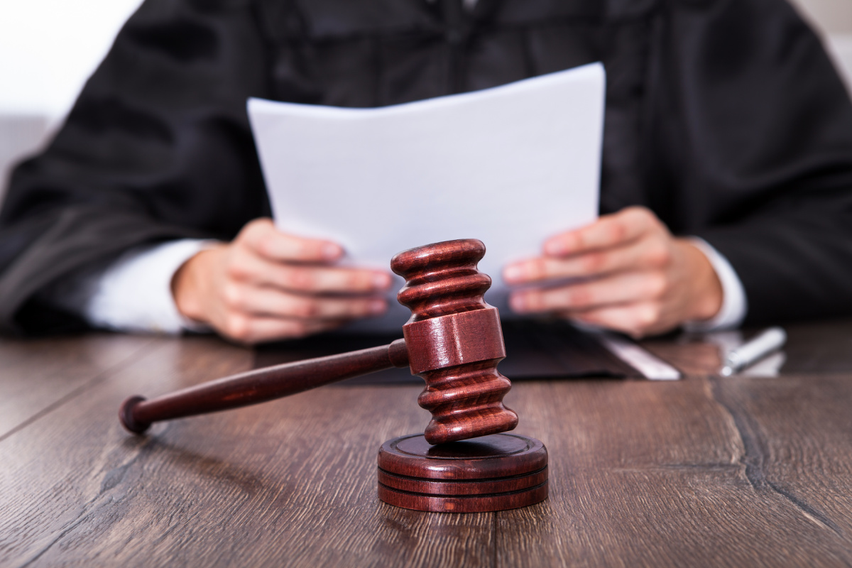 Judge looking at a document before making a decision