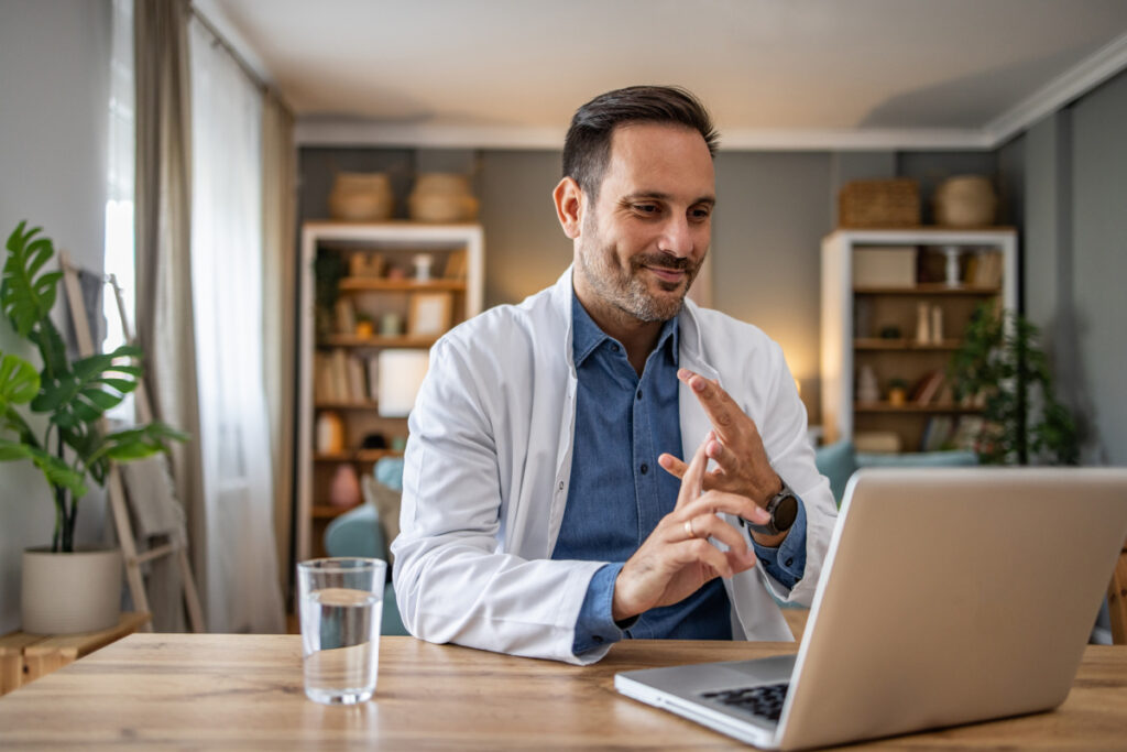 Male physician during a  virtual consultation with Medical Justice