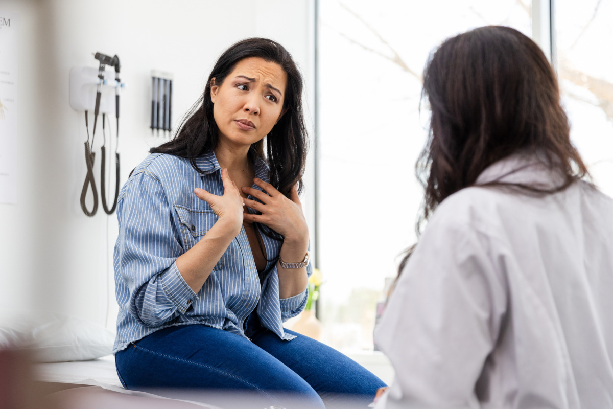 Unhappy patient complaining to doctor after referral
