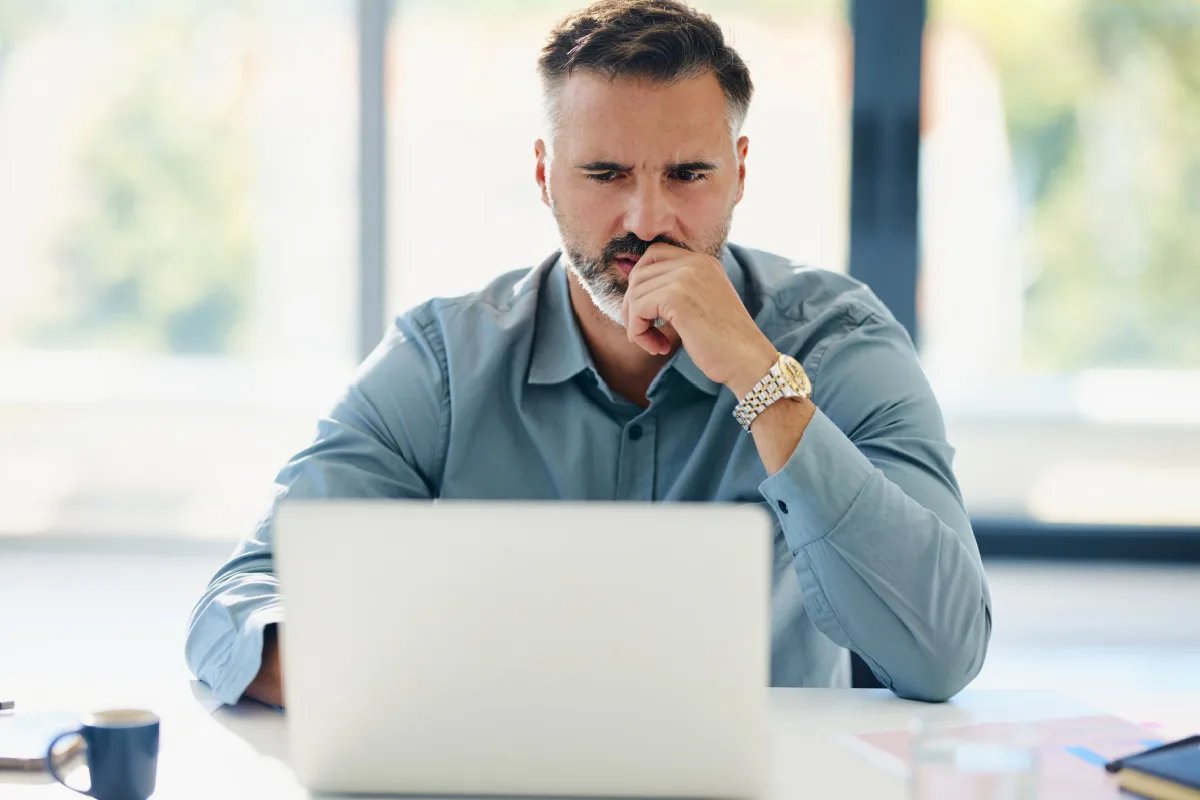 Man reading upsetting reviews online