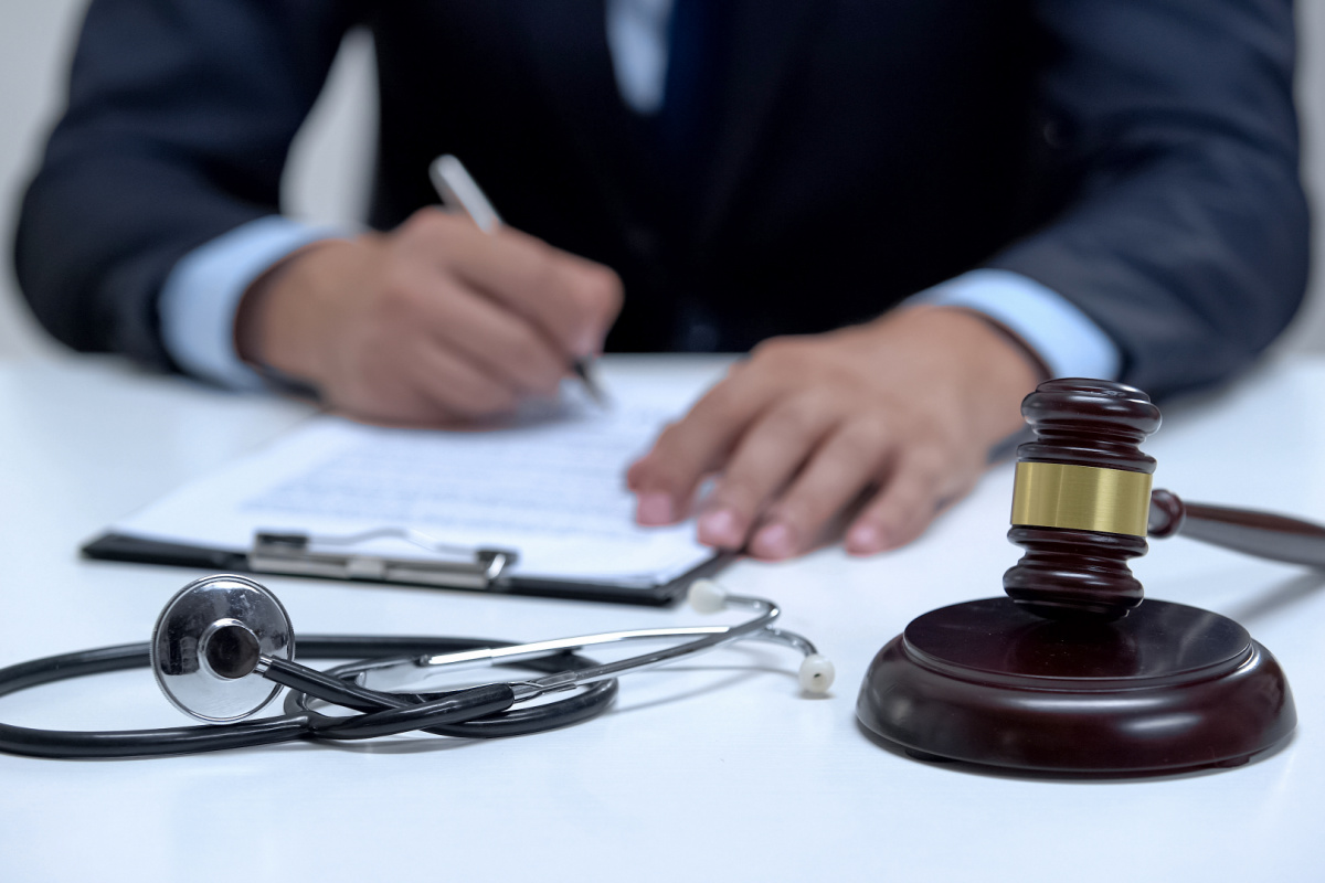 Physician signing contract after medical board hearing