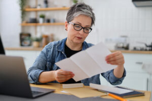Widow reviewing medical records of deceased spouse