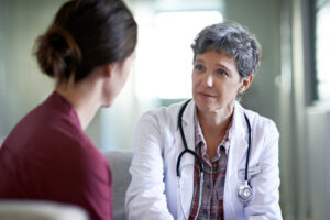 Female physician delivering bad news to a patient