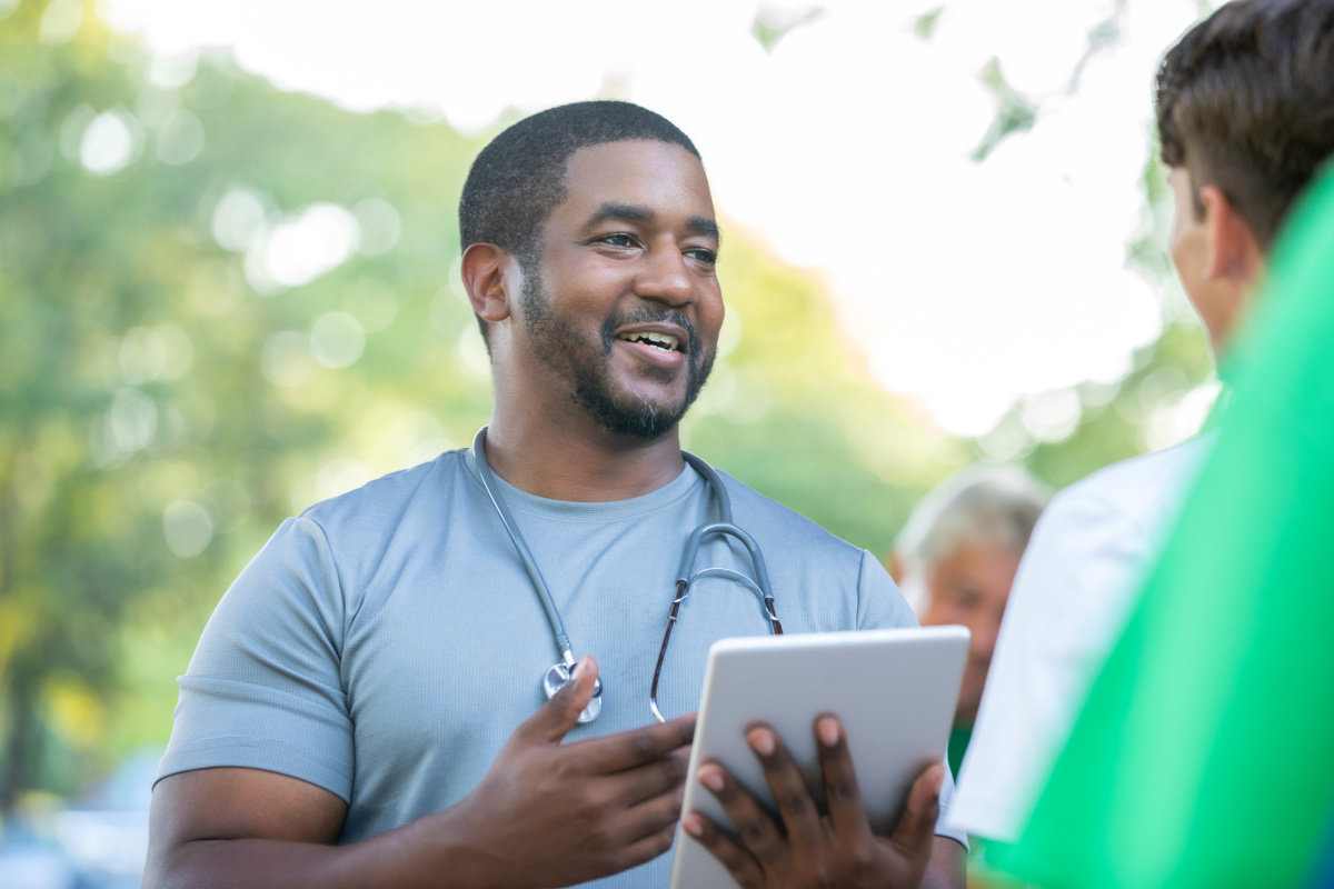 Volunteer physician outside at an event
