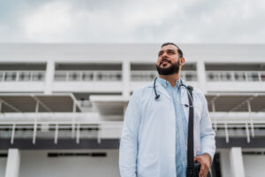 Male physician leaving hospital