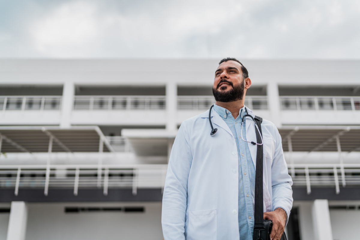 Male physician leaving hospital