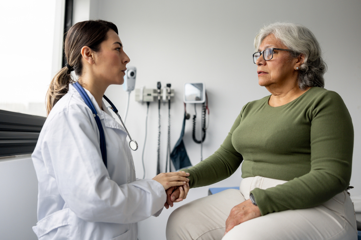 Female physician apologizing to a patient